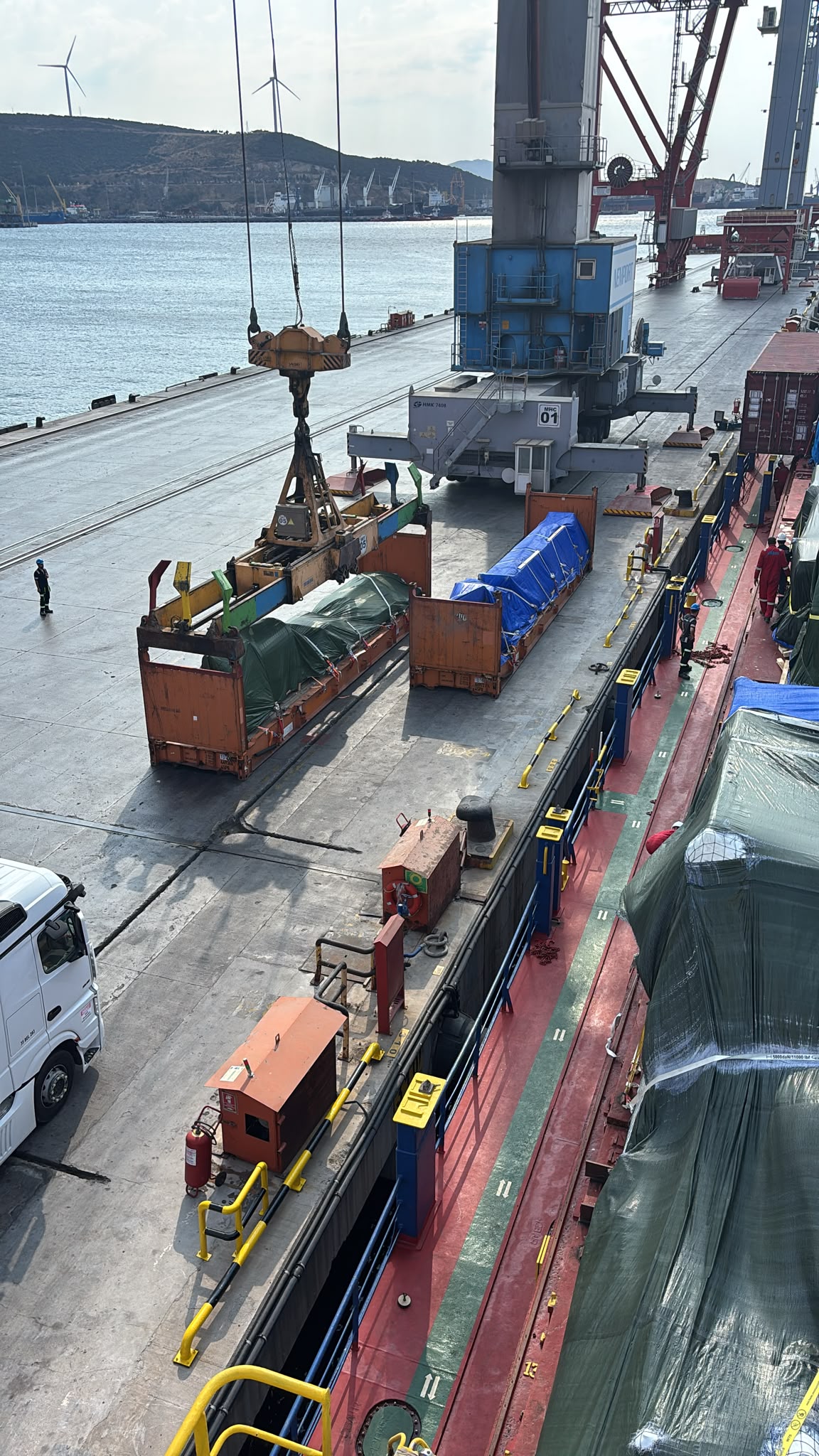 Port cranes loading flat rack containers