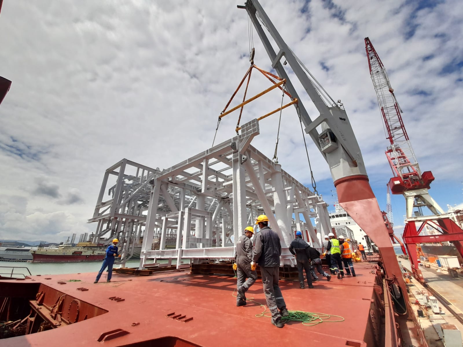 Steel structural frame crane-loaded onto ship